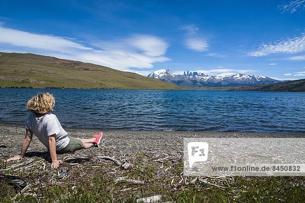 Woman enjoying a beautiful glacier lake in the Torres del Paine National Park  Patagonia  Chile  South America