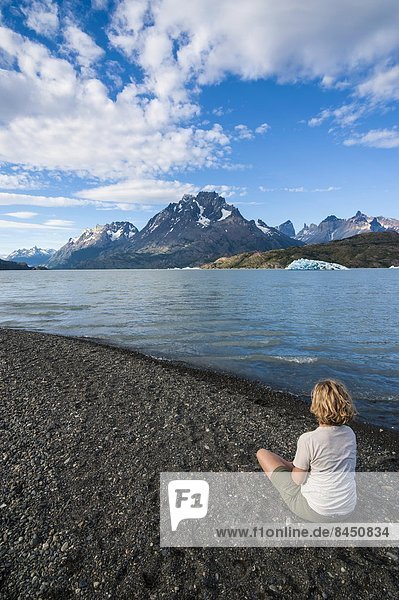 Woman enjoying Lago Grey lake in the Torres del Paine National Park  Patagonia  Chile  South America