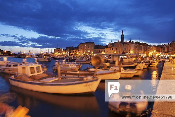 Ships and boats at the harbour and the old town with cathedral of St. Euphemia at dusk  Rovinj  Istria  Croatia  Adriatic  Europe