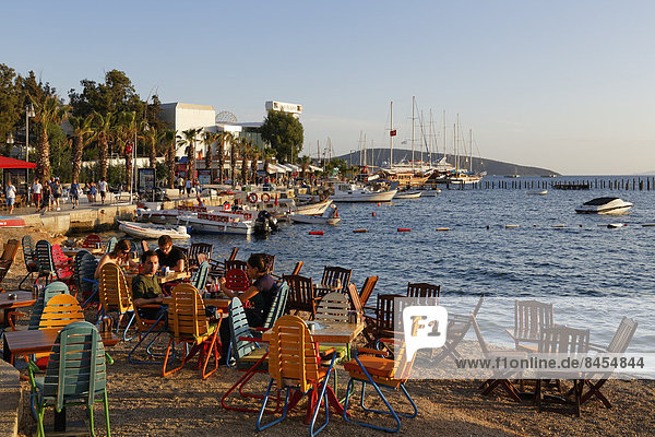 Kumbahce bay with Halicarnassus Club  tables and chairs on the beach  Bodrum  Mugla  Aegean Region  Turkey