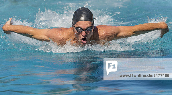 Athletic man swimming