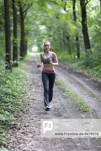 Woman jogging in forest