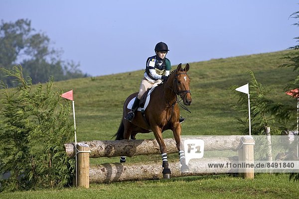 Event riding competing in cross-country phase of competition  Oxfordshire  United Kingdom