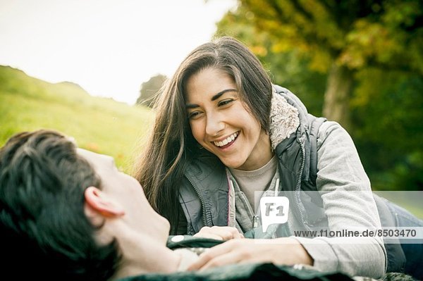 Young couple in park  laughing
