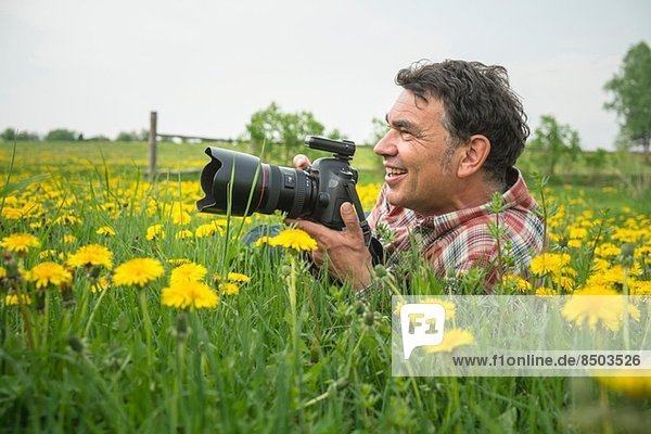 Photographer in field