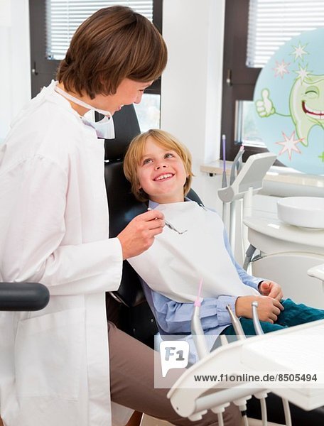 Boy in dentists chair at check up