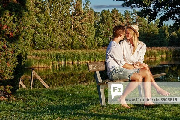 Romantic young couple on park bench  Gavle  Sweden