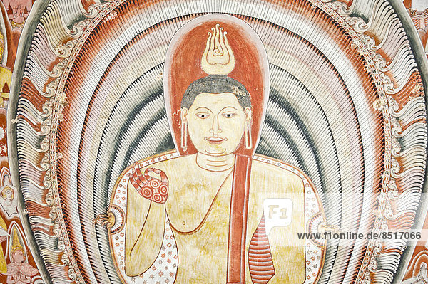 Colourful wall painting  fresco  ornate Buddha  gesture of discussion and Buddhist teaching  Vitarka Mudra  Maharaja-Iena cave  Buddhist cave temple of Dambulla  Golden Temple of Dambulla  Central Province  Sri Lanka
