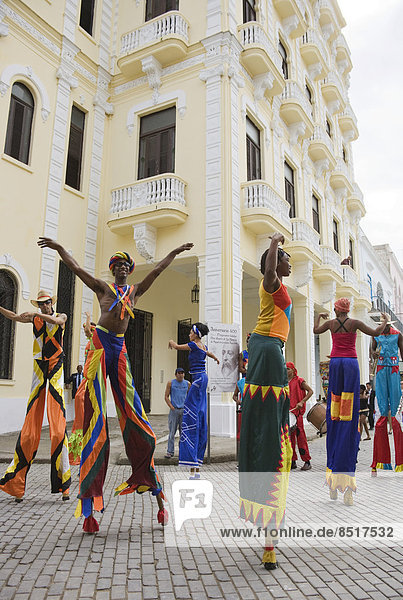 Street performers walking on stilts in Old Havana  Havana  Cuba