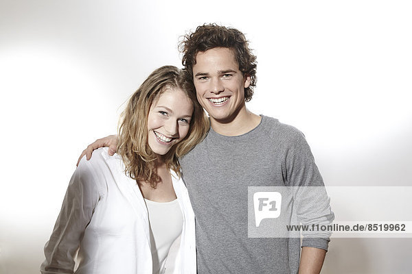 Portrait of happy young couple  studio shot