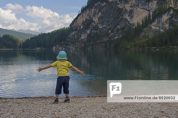 Italy  Trentino-Alto Adige  Alto Adige  Puster ßalley  little boy standing at lakeshore of Lake Prags