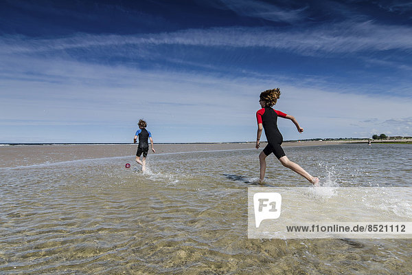 UK  Scotland  Burghead Bay  Children running in water