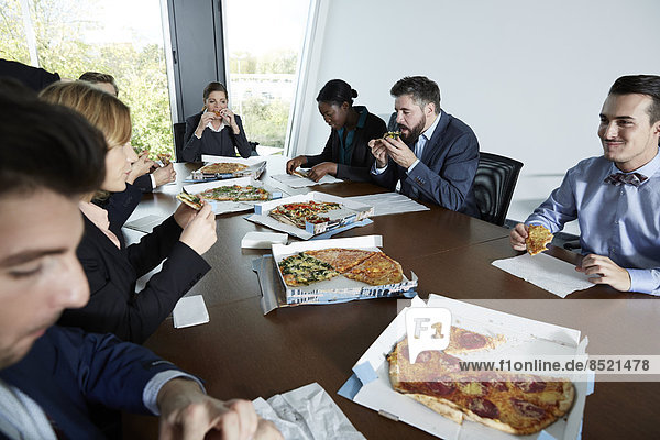 Germany  Neuss  Businesspeople eating pizza