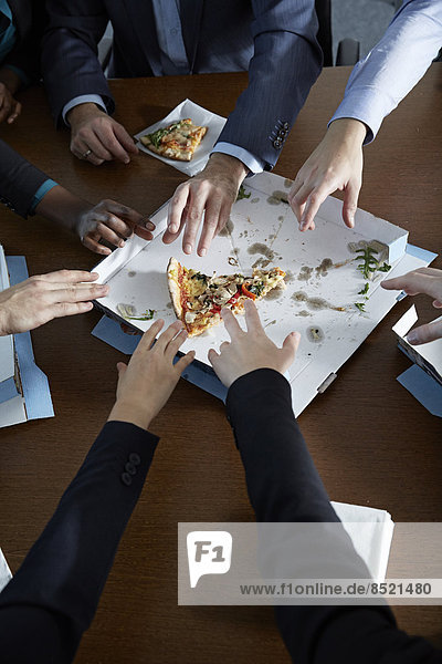 Germnay  Neuss  Hands reaching for pizza