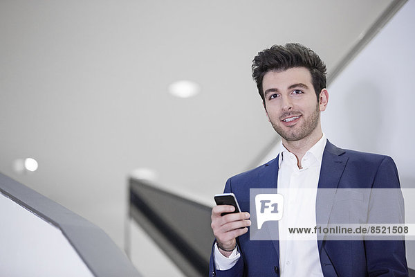 Portrait of a business man using mobile phone