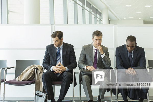 Businessmen sitting in waiting area