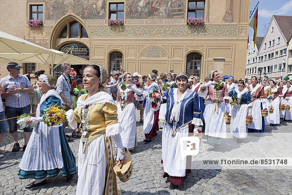 Fishermen's wives during a parade on Marktplatz square in front of the Town Hall  Fischerstechen or water jousting festival  Ulm  Baden-Württemberg  Germany