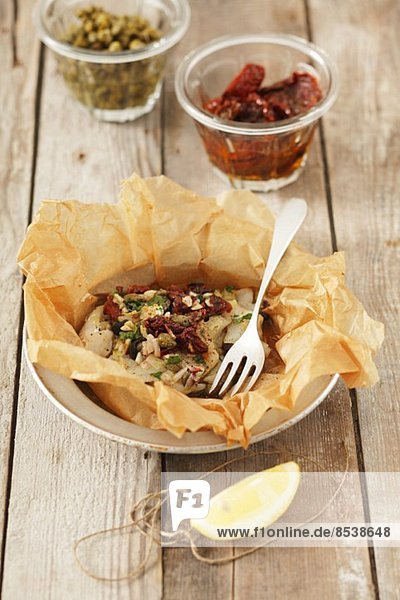 Baked cod with sundried tomatoes and capers