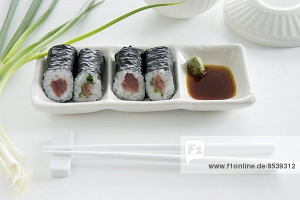 Maki sushi with tuna  salmon and cucumber  with soy sauce and wasabi