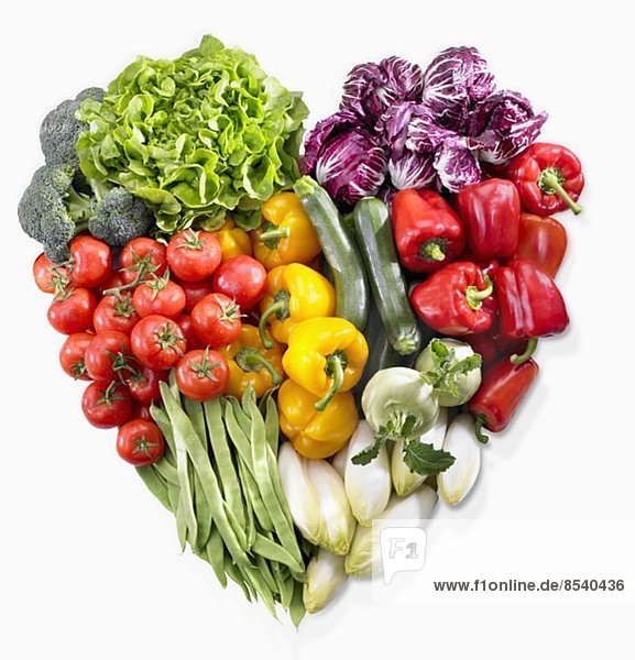 A heart made of vegetables and lettuce