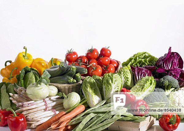 Vegetable still life featuring asparagus and salad