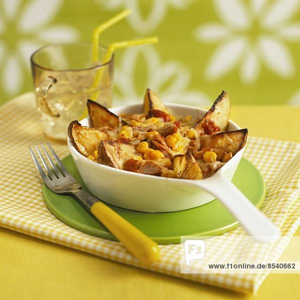 Potato wedges with sweetcorn  topped with cheese and grilled