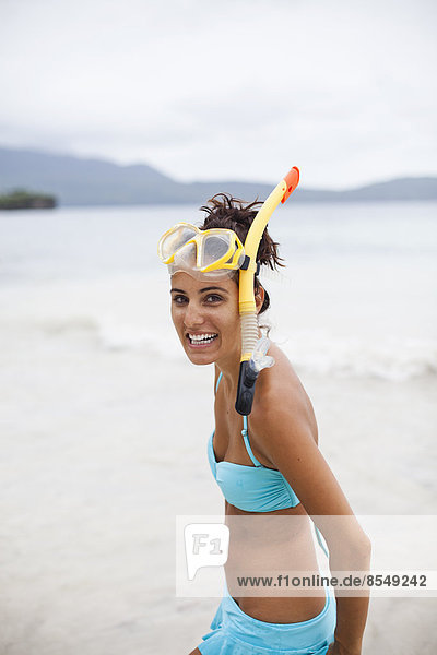 A young woman wearing snorkelling gear on the Samana Peninsula in the Dominican Republic.