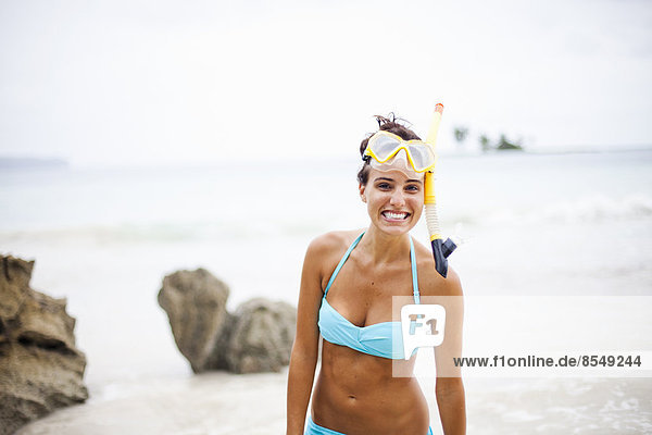 A young woman wearing snorkelling gear on the Samana Peninsula in the Dominican Republic.