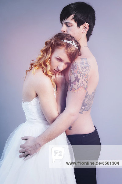 Wedding picture  bride and groom  bare chested groom with tattoos