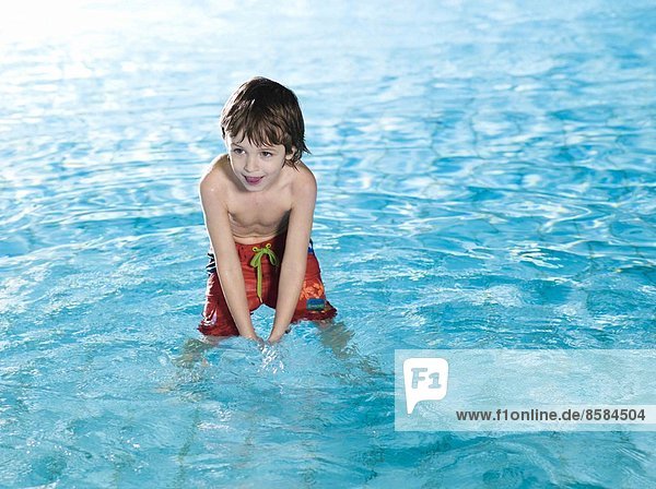 Boy smiling at the swimming pool