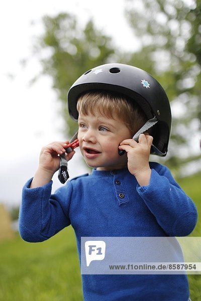 Portrait of a little boy wearing a helmet