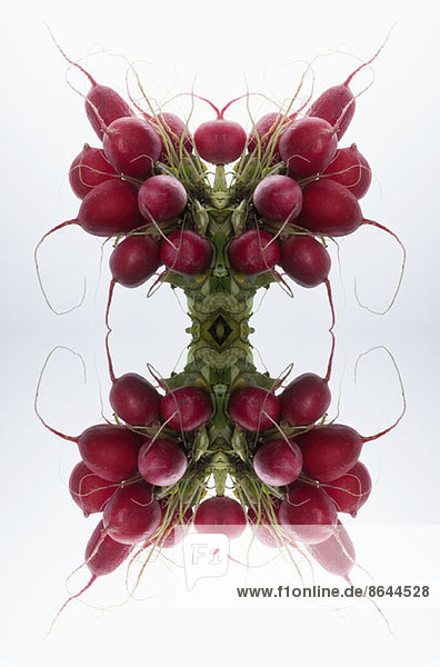 A digital composite of mirrored images of bunches of radishes