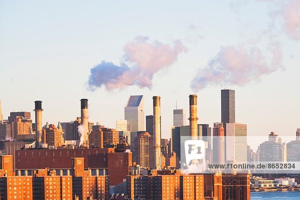 New York cityscape with smoke stacks on skyline