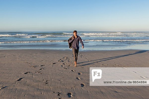 Man walking on beach