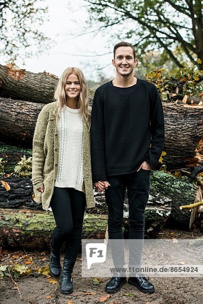Portrait of young happy couple in woods