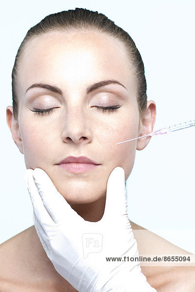 Woman receiving collagen injection