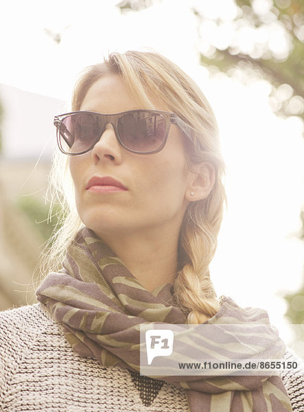 Woman wearing sunglasses and scarf  portrait