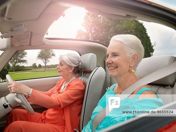 Senior women driving in convertible