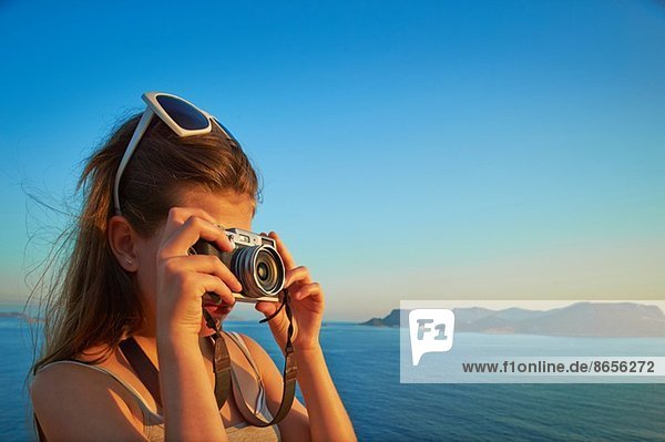 Girl taking photographs on holiday  Kas  Turkey