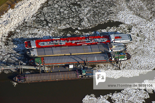 Aerial view  barges in the ice at Aussschläger Elbdeich  Elbe river dyke  in Billwerder Bucht bay  winter break  Hamburg  Germany
