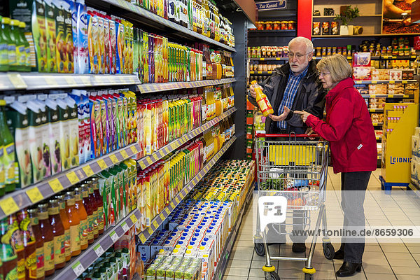 Senior couple shopping in a supermarket  Germany