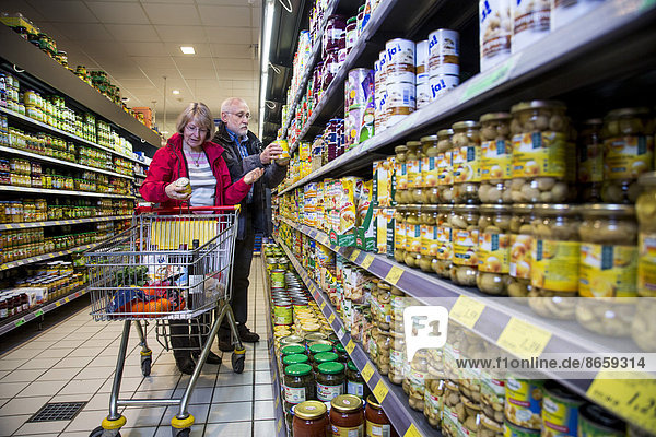 Senior couple shopping in a supermarket  Germany
