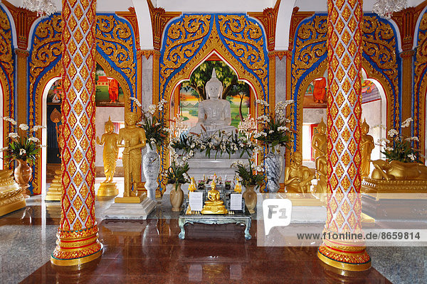 Buddhist altar and ornate columns  Wat Chalong temple  Phuket  Thailand