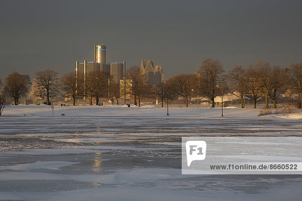 Downtown Detroit from Belle Isle  a city park in the middle of the river  with the island's frozen Scott Fountain Lagoon at the front  Detroit  Michigan  United States