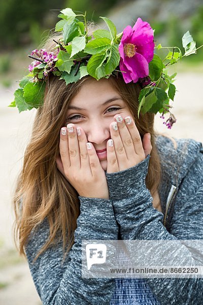 Teenage girl wearing wreath of flowers  Nykoping  Sodermanland  Sweden