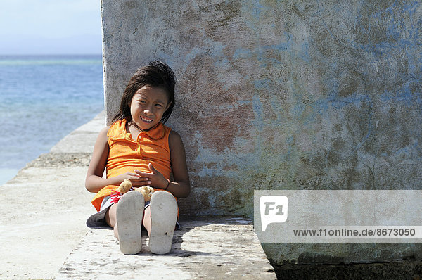 Kuna Indian girl in a Kuna Indian village  Nalunega  San Blas Islands  Panama