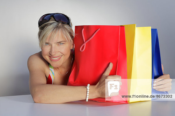 Woman with colorful shopping bags  Germany