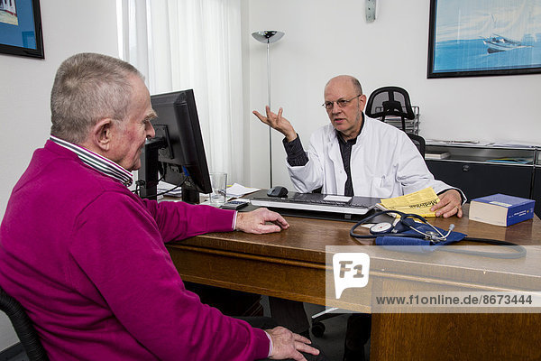 Medical practice  elderly patient talking to the doctor  Germany