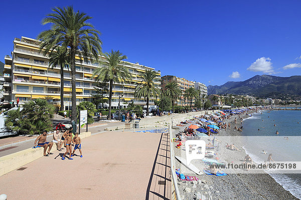 Beach of Carnolès looking towards the ridge of the border to Italy Roquebrune Cap Martin Maritime Alps Provence Alpes Côte d'Azur France