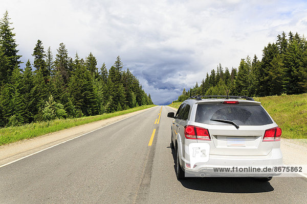 Canada British Columbia Rocky Mountains car on the road through Mount Robson Provincial Park